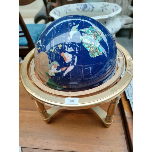 358 - Large semi precious world globe on brass stand .