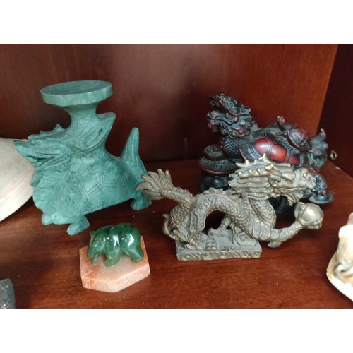 342 - Lot of oriental themed collectables includes bronzed dragon etc .