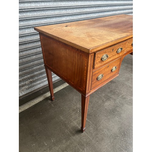 840 - 19th century knee hole desk, the rectangular top with banding above an arrangement of short drawers ... 