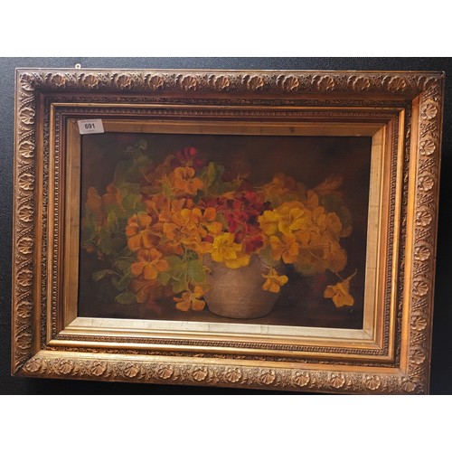 691 - Original still life oil painting on canvas depicting flowers within a pot. Fitted with an ornate gil... 