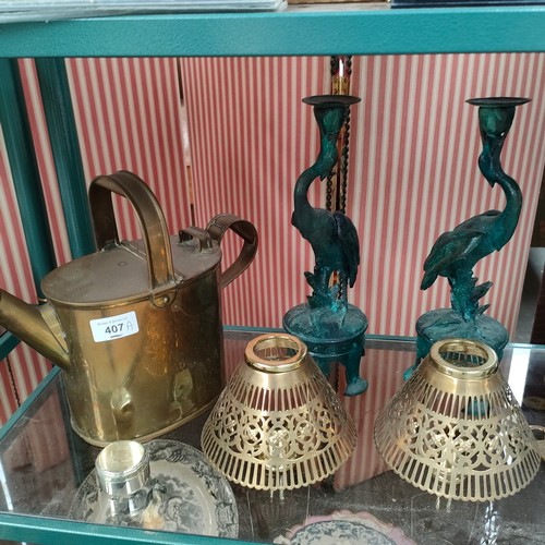 407a - Shelf of collectables includes brass watering can , metal bronze style bird candle sticks etc .