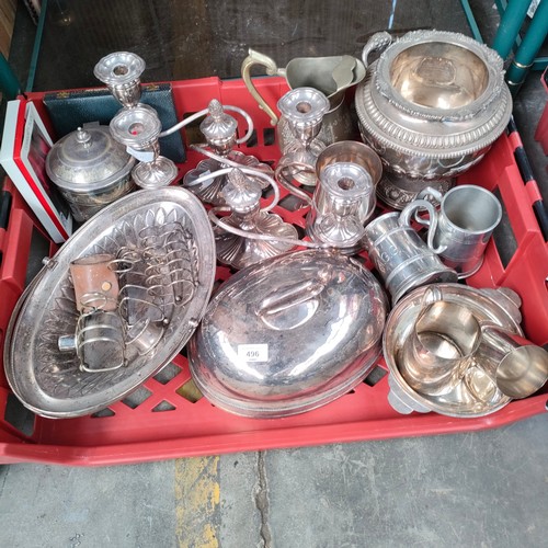 496 - 2 Large boxes of silver plated wares includes candle sticks , dishes , antique glasses etc.