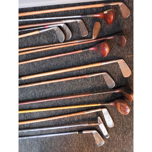 734 - Hickory shafted golf clubs within leather bound carrier, some to include various branded names from ... 