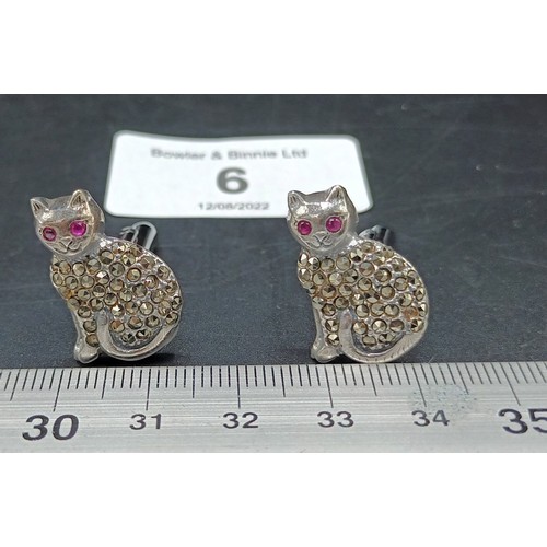 6A - A pair of silver and marcastie cat cufflinks with ruby eyes