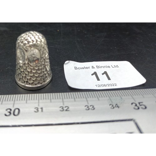 11A - A thimble with owl embossed decoration