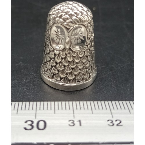 11A - A thimble with owl embossed decoration