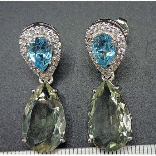 22A - A pair of silver cz and pear shaped aquamarine earrings