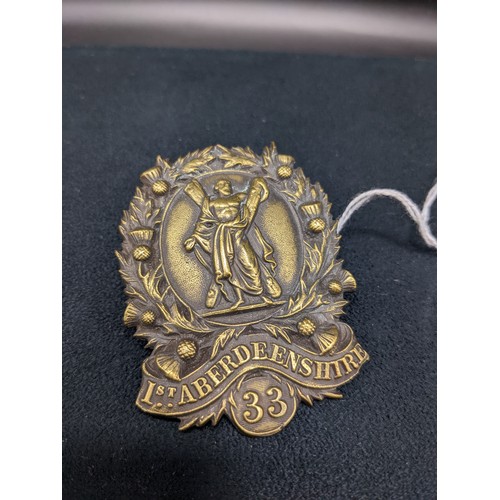 52A - Brass cap badge [1st Aberdeenshire 33]