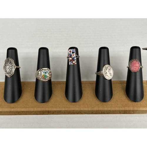 41 - Five various silver rings. Includes art deco design ring, silver and enamel floral ring, Indian swiv... 