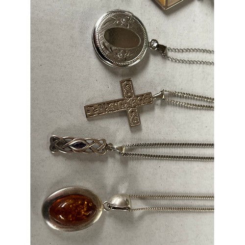 43 - 6 Silver chains and silver pendants together with silver brooch. Includes locket pendant and garnet ... 