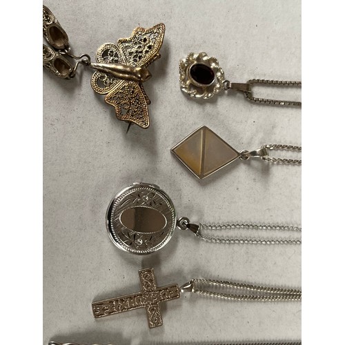 43 - 6 Silver chains and silver pendants together with silver brooch. Includes locket pendant and garnet ... 