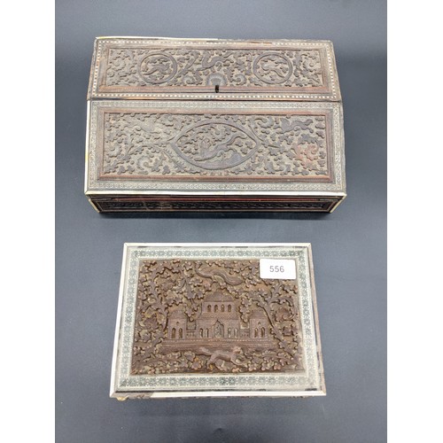 556 - Antique writing box with one other, both with highly carved wooden design and marquetry