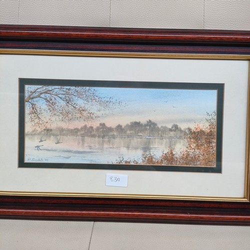 83a - Water colour depicting birds flying over lake signed P . Swindells .