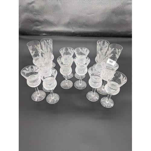 562 - Six Edinburgh crystal thistle cut champagne flutes together with ten thistle cut wine glasses