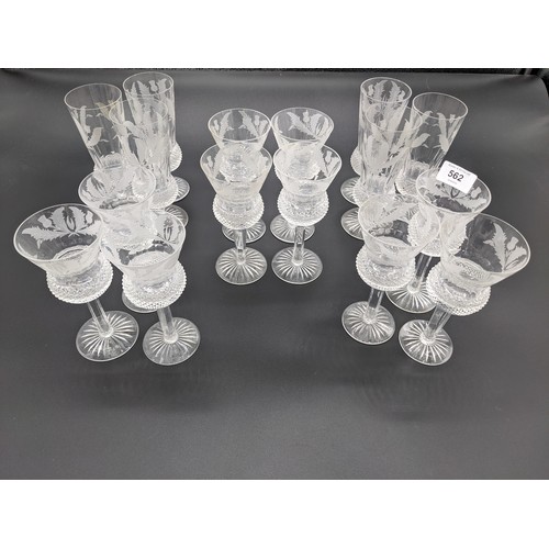 562 - Six Edinburgh crystal thistle cut champagne flutes together with ten thistle cut wine glasses