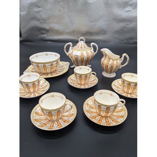 717 - Fourteen piece antique porcelain tea set in a gilt/gold design