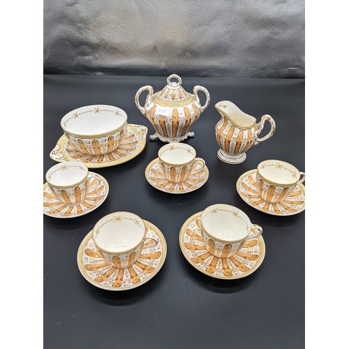 717 - Fourteen piece antique porcelain tea set in a gilt/gold design