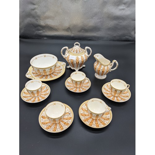 717 - Fourteen piece antique porcelain tea set in a gilt/gold design