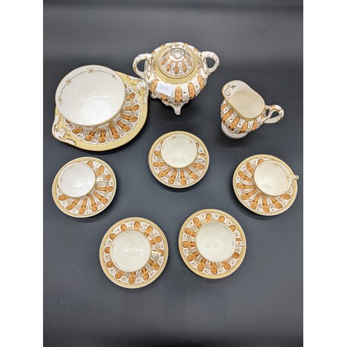 717 - Fourteen piece antique porcelain tea set in a gilt/gold design