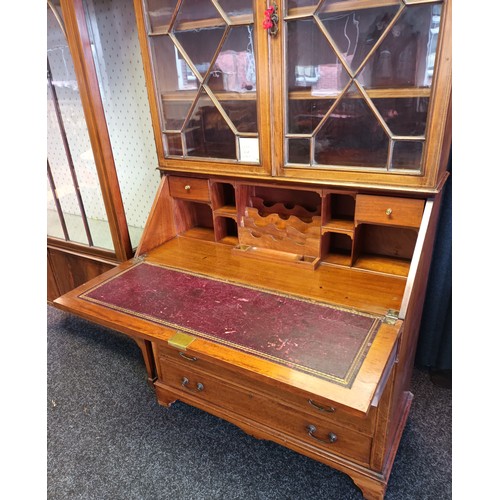 770a - 19th century bureau [W.J. Mansell] the moulded cornice above two glass doors with moulded design, le... 