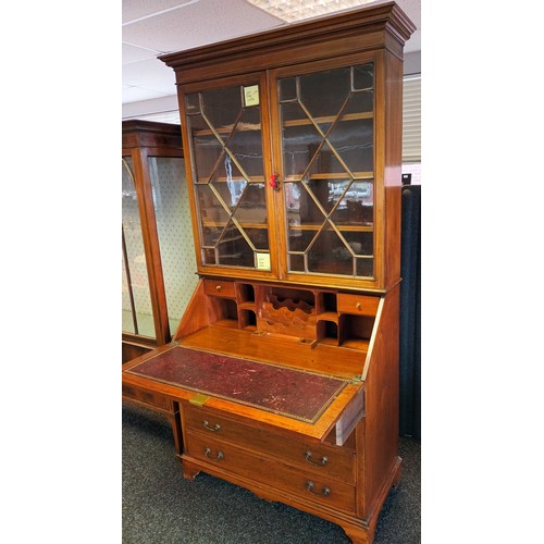 770a - 19th century bureau [W.J. Mansell] the moulded cornice above two glass doors with moulded design, le... 