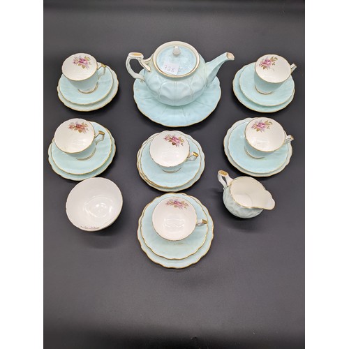 728 - 23 piece Aynsley bone china tea set with teapot, plate, sugar and cream in a blue and floral design