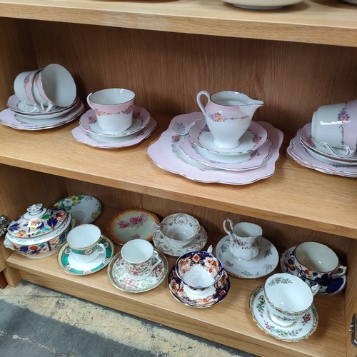 124a - Colclough tea service together with shelf of cups and saucers .