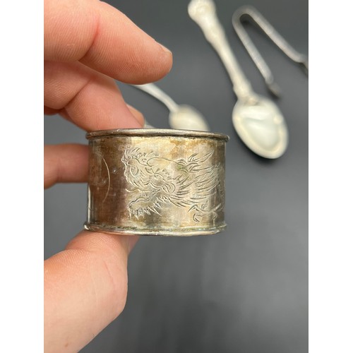 548 - Collection of silver marked flatwares includes Chinese silver tea spoon and napkin ring. [134grams]