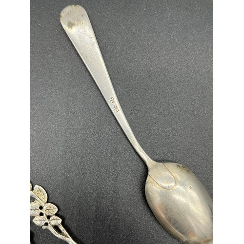 548 - Collection of silver marked flatwares includes Chinese silver tea spoon and napkin ring. [134grams]