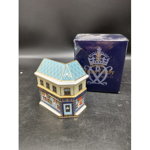 54 - Royal crown Derby the sweet shop figure with box . 8cm in height .