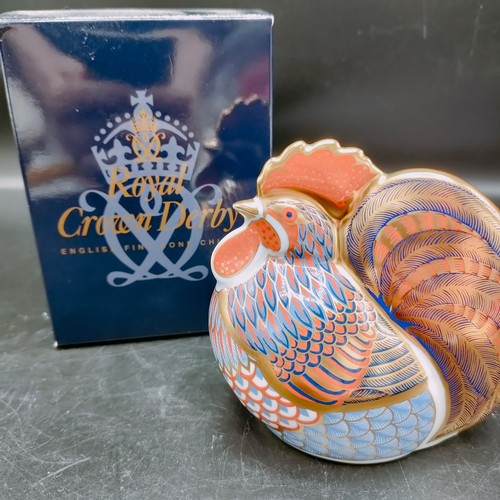 105 - Royal crown Derby red roaster paperweight with stopper and box. 10 cm in height.