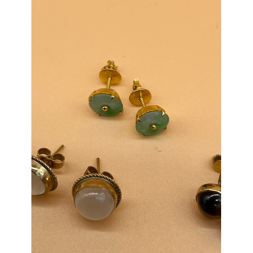 6 - Three pair of gold earrings, Includes Opalescent and 9ct gold earrings, 9ct gold and tiger eye stone... 