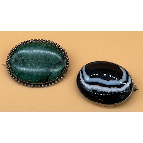 8 - Two White metal and hardstone brooches. [Malecite and agate]