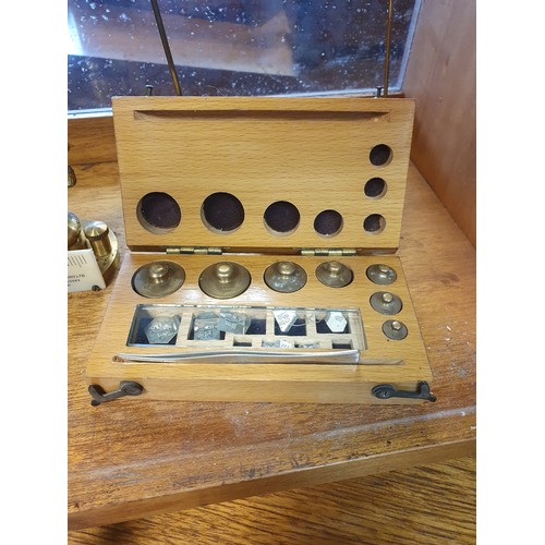 567 - Cased balancing measuring scales, produced by Baird & Tatlock London.