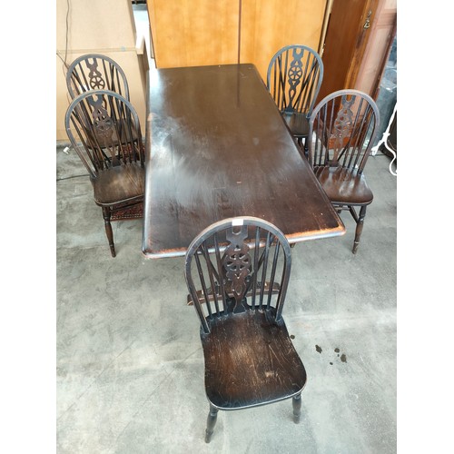 177 - Ercol style table with Five-wheel back chairs.