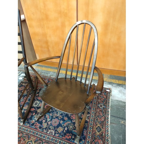 174 - Ercol elm wood rocking chair together with vintage ladder-back rocking chair.