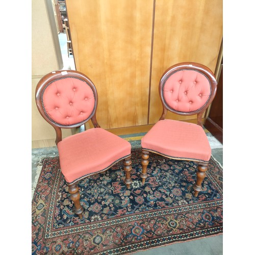 167 - Pair of Victorian button back chairs. Supported on turned legs. [One has signs of old wood worm]