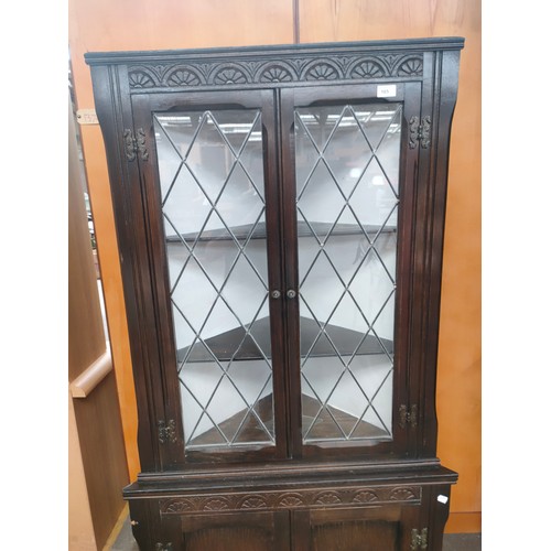 165 - Old charm style oak corner cabinet. Needs replacement glass.