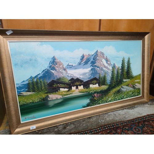 160 - Large oil painting depicting mountain scene with rural buildings to front fitted in a gilt frame sig... 