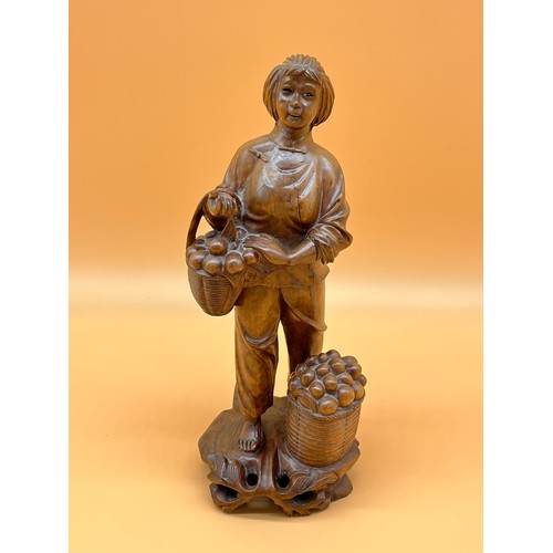 24 - Antique Chinese root wood hand carved figure of a lady holding a basket of fruit. [Will post] [31cm ... 