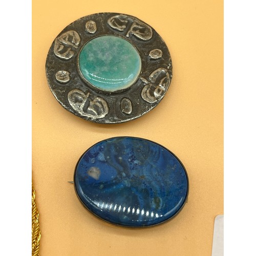 34 - Arts and Crafts Ruskin brooch, together with a silver and blue agate stone brooch. Also in the lot i... 