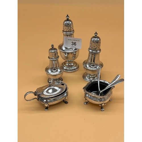 36 - Collection of silver condiment items to include Three silver Birmingham and Chester pepper pots, Bir... 