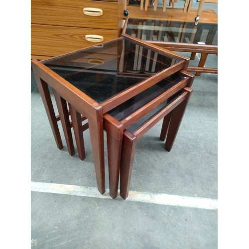 215 - Mid Century 70s Danish Style Teak coffee table with smoked glass insert together with Nest of Tables... 