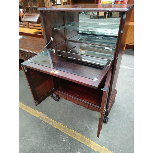 128a - Reproduction Antique style cocktail cabinet with fitted shelves.