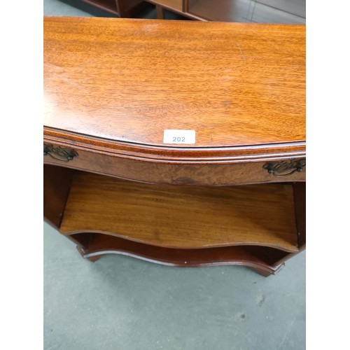 202 - Mahogany and Bur walnut bow front bookcase with fitted drawers.