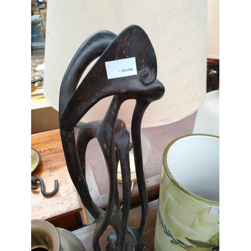 221 - Large ceramic umbrella stand, stylish metal planter and jug together with African carved figure.