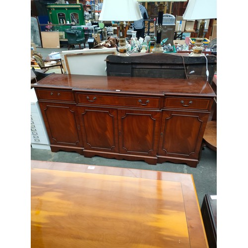 216 - Large reproduction breakfront sideboard.