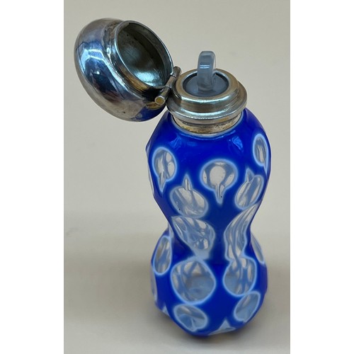 543 - Antique facet cut glass perfume bottle, designed with white and blue glass sectioned glass. Fitted w... 