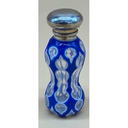 543 - Antique facet cut glass perfume bottle, designed with white and blue glass sectioned glass. Fitted w... 