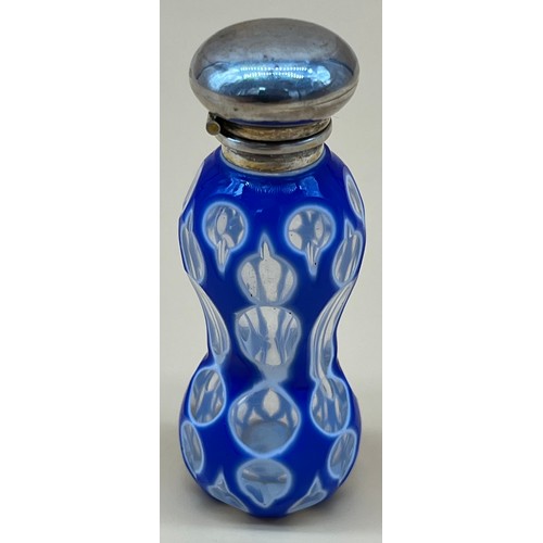 543 - Antique facet cut glass perfume bottle, designed with white and blue glass sectioned glass. Fitted w... 